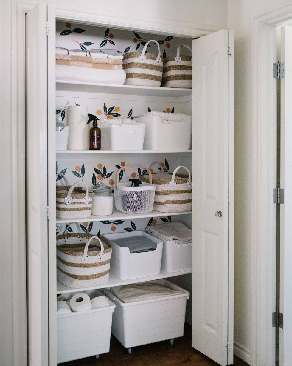 bathroom closet linens baskets with storage containers wallpaper backing toilet paper towels