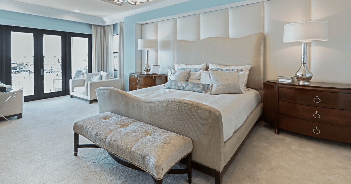 Large master bedroom with ceiling-to-floor windows.