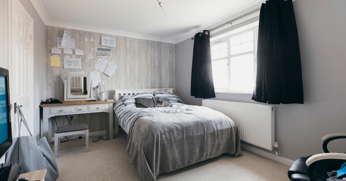 A small boys bedroom with cozy bed.