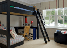 A bunk bed with desk underneath.