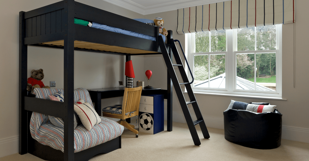 A bunk bed with desk underneath.