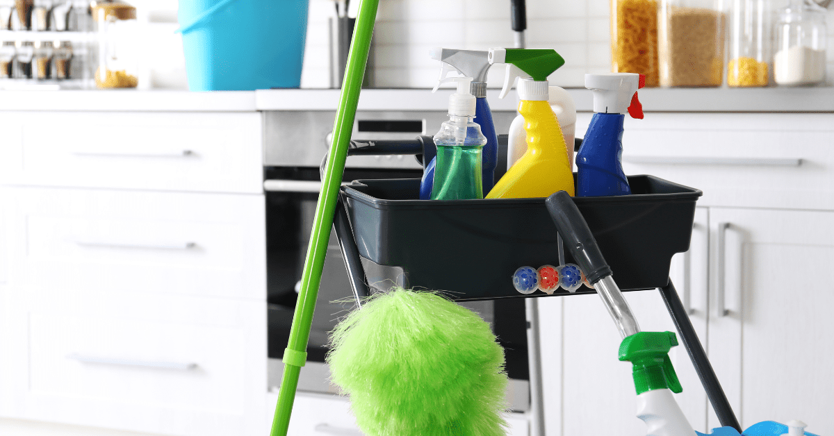 A rolling cart storage for cleaning supplies.