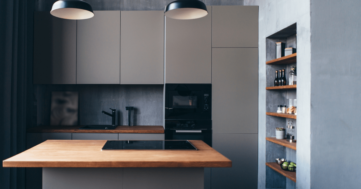 A minimalist kitchen with a stove built in the island.