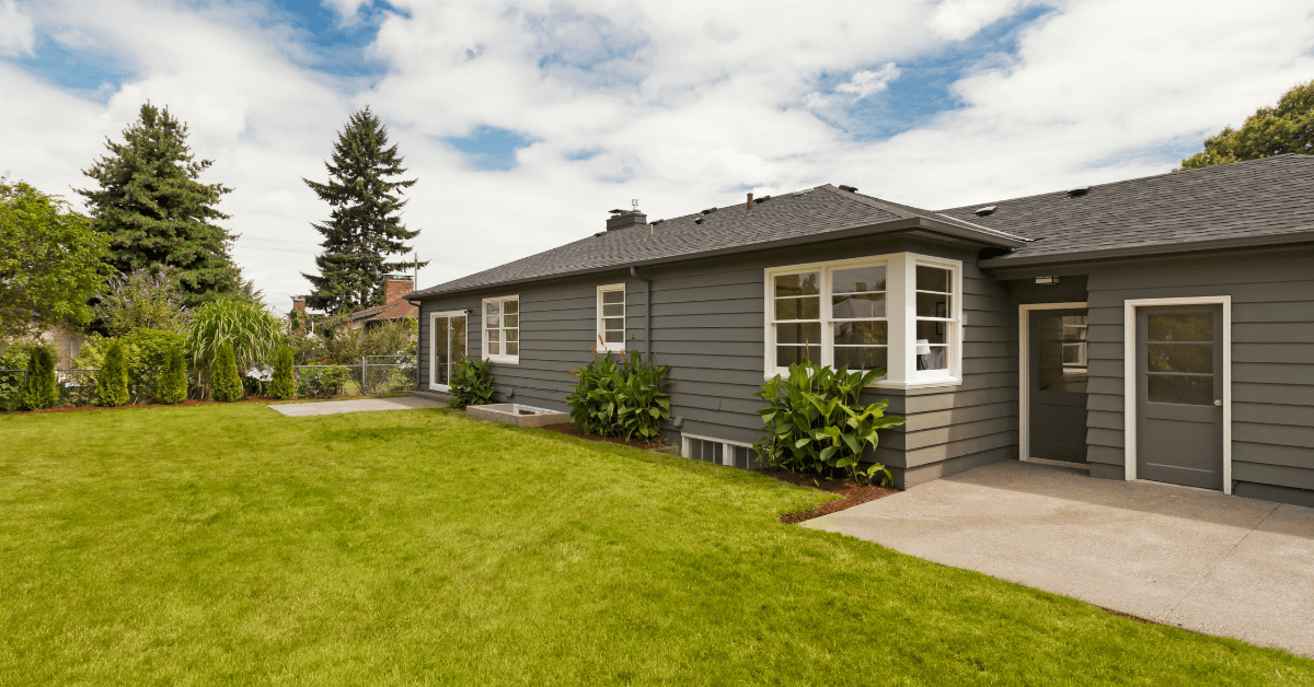 Charcoal gray ranch style house exterior color.