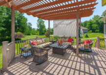 large deck with patio furniture and pergola