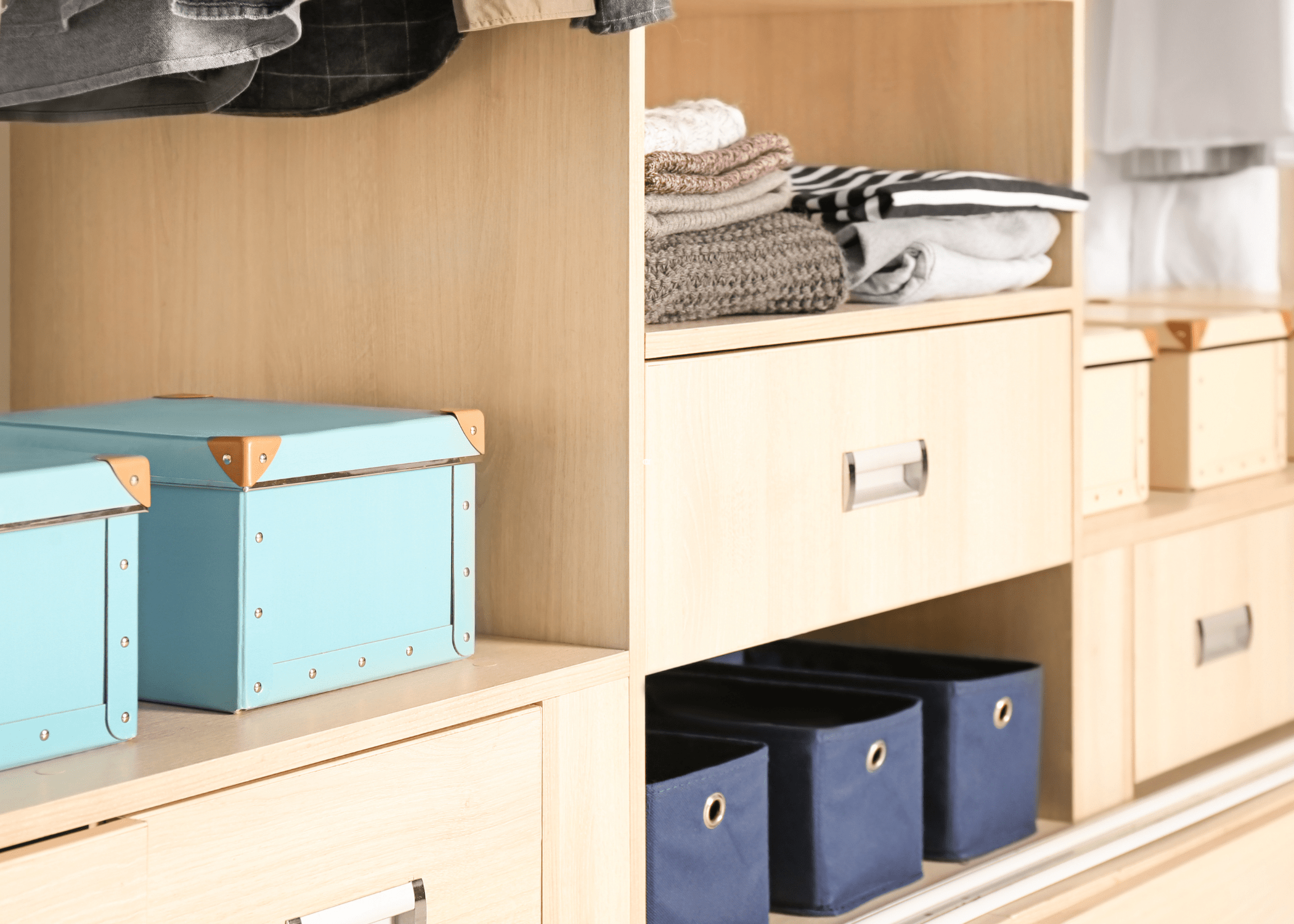 organized shelf with boxes and storage containers