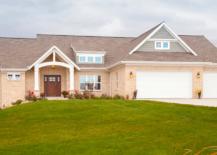 A modern ranch style house with beige exterior color.