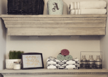 Floating shelves in a half bathroom.