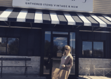 woman standing outside of The Found Cottage vintage antique store